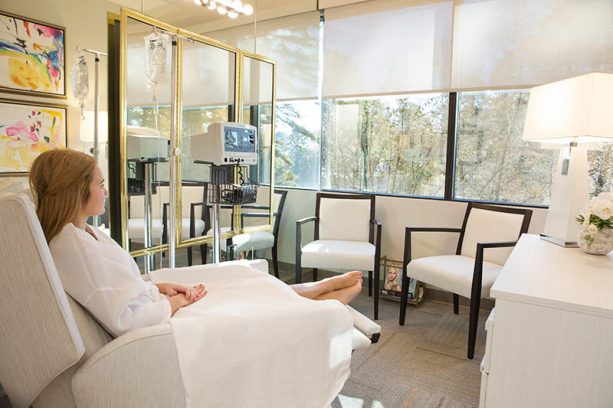 preoperative area with relaxing white chairs to meet with our cosmetic surgeon