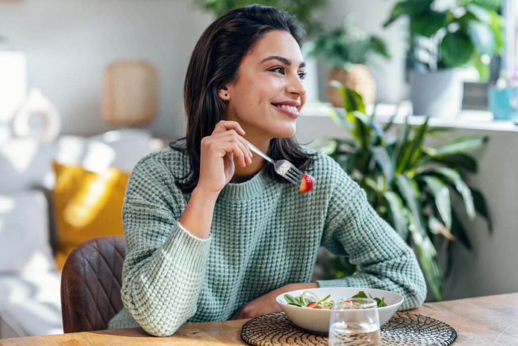 Woman eating healthy salad while on semaglutide weight loss plan